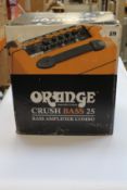 An Orange Crush bass 25 amplifier combo.