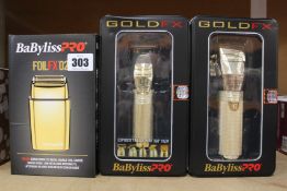An as new BaBylissPRO Gold FX870G metal lithium clipper, an as new BaBylissPRO Gold FX787G metal
