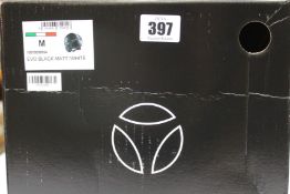 A boxed as new Momo Design EVO Fighter motorcycle helmet in matt black/white (M).