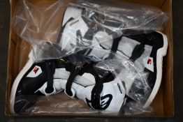 A pair of youths boxed as new Alpine Stars Tech 3S Off-road Boots in back and white (EU 34).