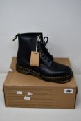 A pair of as new Dr Martens 1460 boots (UK 8).