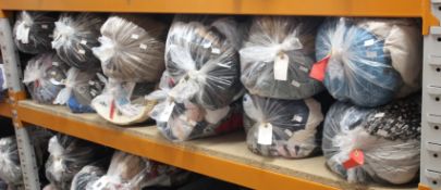 Twelve bags of pre-owned clothing and related items.