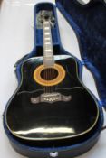 A pre-owned Ibanez Concord 752 'Black Beauty' Acoustic Guitar with case and some accessories.