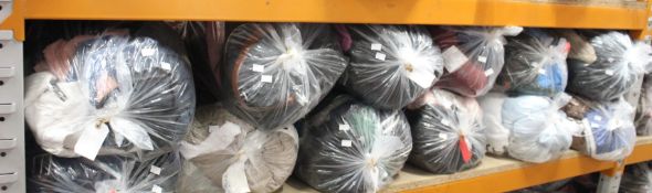 Twelve bags of pre-owned clothing and related items.