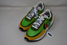 A pair of as new Sacai X Nike LDV Waffle daybreak green with authentication tag (UK 4.5 - No box).
