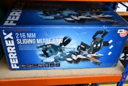 A boxed as new Ferrex 216MM Sliding Mitre Saw.