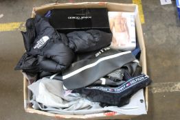 A box of as new and pre-owned clothing and related items.