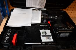 A Panasonic cordless 18V brushless combo kit with two 5.0Ah li-ion batteries and charger (