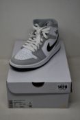A pair of women's as new Nike Air Jordan 1 Mid (UK 5).