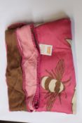 An as new Karen Mabon X Peter Rabbit woven raspberry blanket, part of a limited-edition capsule