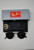 A pair of as new Ray Ban sunglasses.