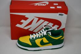 A pair of as new Nike Dunk Low (UK 9).