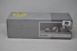 A boxed as new Kosta Boda Snowball Votive Holder Set (3 pcs H 60/70/90mm).