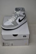 A pair of women's as new Nike Air Jordan 1 Mid (UK 5).