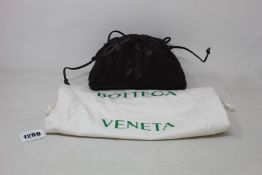 A pre-owned Bottega Veneta The Pouch 20 Intrecciato crossbody in dark brown (Very good condition).