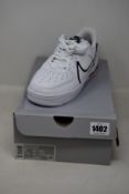 A pair of as new Nike Air Force 1 React (UK 5.5).