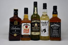 A bottle of Jack Daniels Tennessee whiskey (1ltr), a bottle of Jim Beam Red Stag bourbon (700ml),