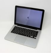 A pre-owned Apple Macbook Pro (13 Inch, Mid 2010) with 2.4GHz Intel Core 2 Duo CPU, 4GB RAM and
