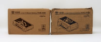 A boxed as new IDX System Technology CUE-H180 179Wh Compact Li-Ion V-Mount Battery and a boxed as
