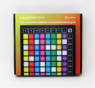 A boxed as new Novation Launchpad X (Midi controller for Ableton Live).
