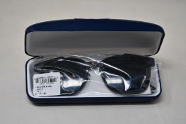 A pair of as new Lacoste sunglasses.