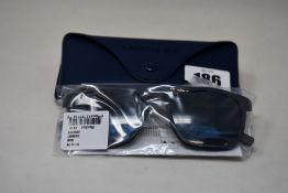 A pair of as new Lacoste sunglasses.