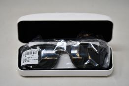 A pair of as new Calvin Klein sunglasses.