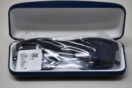 A pair of as new Lacoste sunglasses.