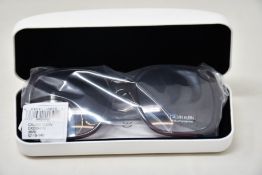 A pair of as new Calvin Klein sunglasses.