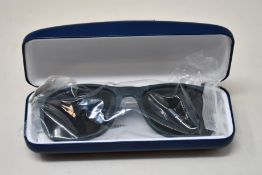 A pair of as new Lacoste sunglasses.