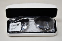A pair of as new Calvin Klein sunglasses.