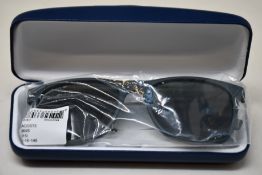 A pair of as new Lacoste sunglasses.