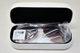 A pair of as new Calvin Klein sunglasses.