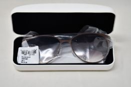A pair of as new Calvin Klein sunglasses.