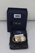 An as new Dior 'CD' belt buckle in box.