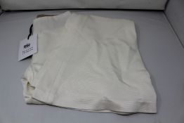 A pair of as new Galvan London Jersey flared trousers in white (UK 10).