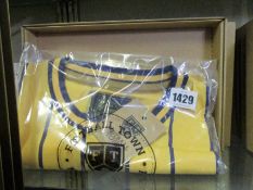 Five assorted as new Football Town retro football jerseys.