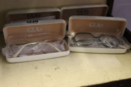 Four pairs of as new Glas reading glasses.