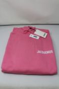 An as new Jacquemus Le Sweatshirt hoodie in pink (L).