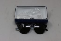 A pair of as new Lacoste sunglasses.