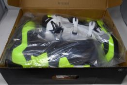 A pair of youths boxed as new Alpine Stars Tech 3S Off-road Boots in back, white and fluorescent