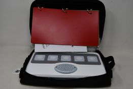 An as new LoganTech Proxtalker device with blank programmable cards for verbal picture communication