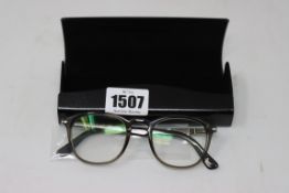 A pair of as new Persol glasses frames.