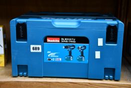 An as new Makita DLX2131TJ twin cordless drill set, includes 1x DHP482 combi drill, 1x DTD152 impact