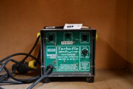 A pre-owned Turbo-Flo Fresh Air Hose Breathing Apparatus.