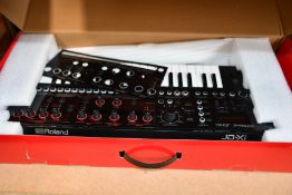 A boxed pre-owned Roland Interactive Analog/Digital Crossover JD Xi synthesizer (No power lead,