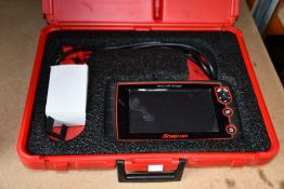 A pre-owned Snap-On Sollus Edge Diagnostics System with a case (Item powers on but is untested) (