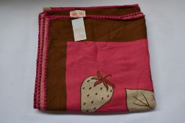 An as new Karen Mabon X Peter Rabbit woven raspberry blanket, part of a limited-edition capsule