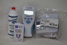 A Welch Allyn Suretemp Plus thermometer (# 01692-100) and a Welch Allyn wall holder.