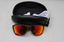 A pair of as new Oakley Custom sunglasses.